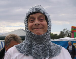 Dad in a chain mail hood at a craft fair.